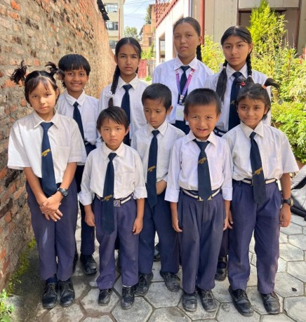 Orphanage Kids in Nagarjun Provided with Shoes, Sporting Goods, Stationaries